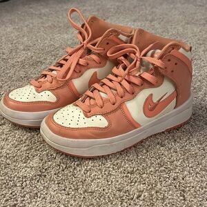 Women’s high top coral Nike shoes